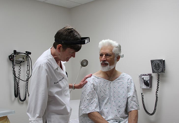 doctor with patient at an MKM free screening clinic