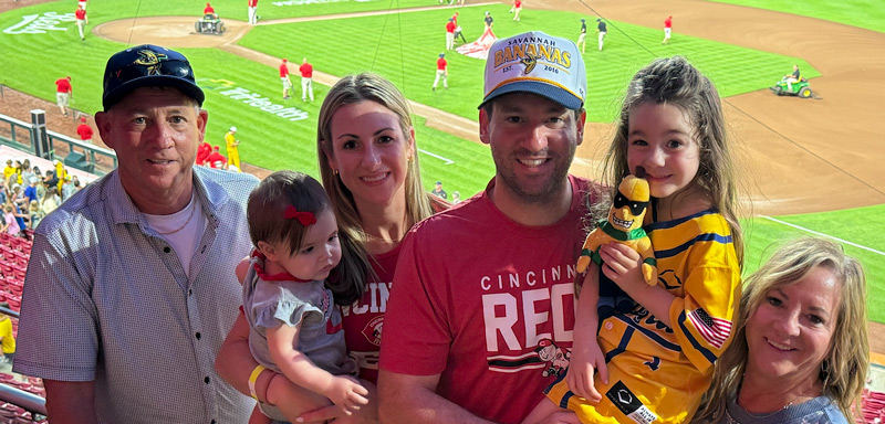 Alex Burkhart with his parents, his wife and two daughters at a Cincinnati Reds game.